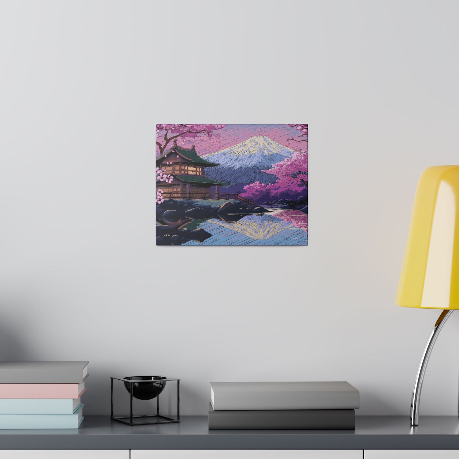 a table with a lamp and a painting on it